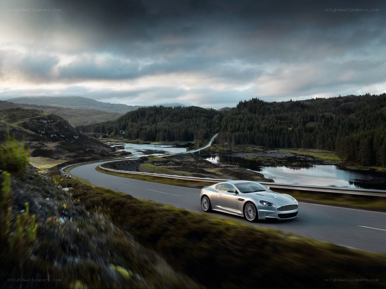 Silver car on winding road