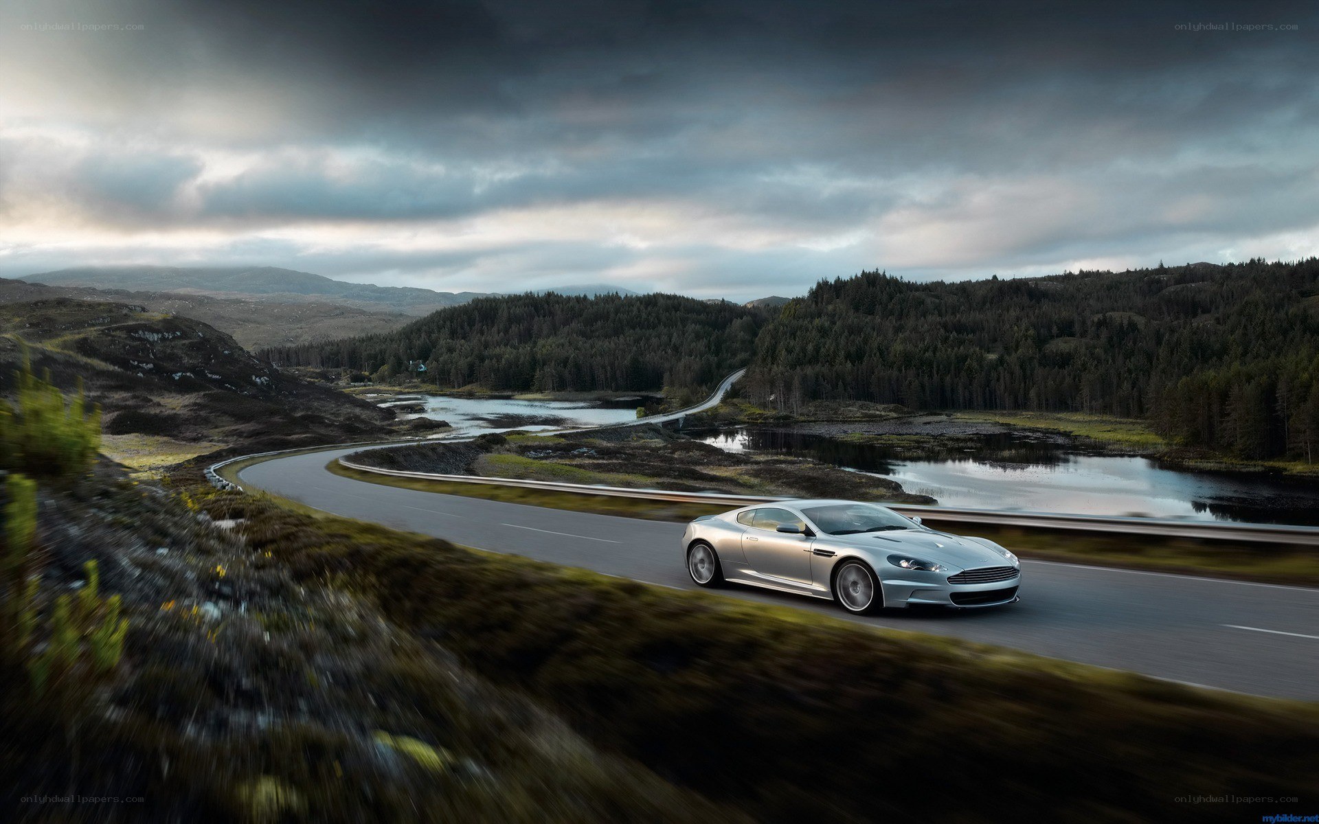 Silver car on winding road