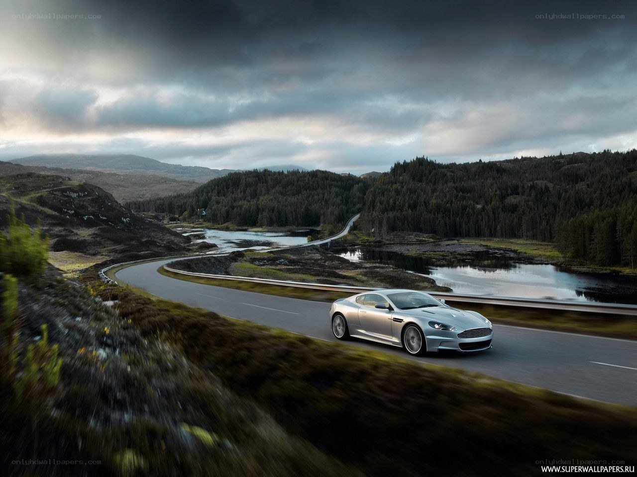 Silver car on winding road