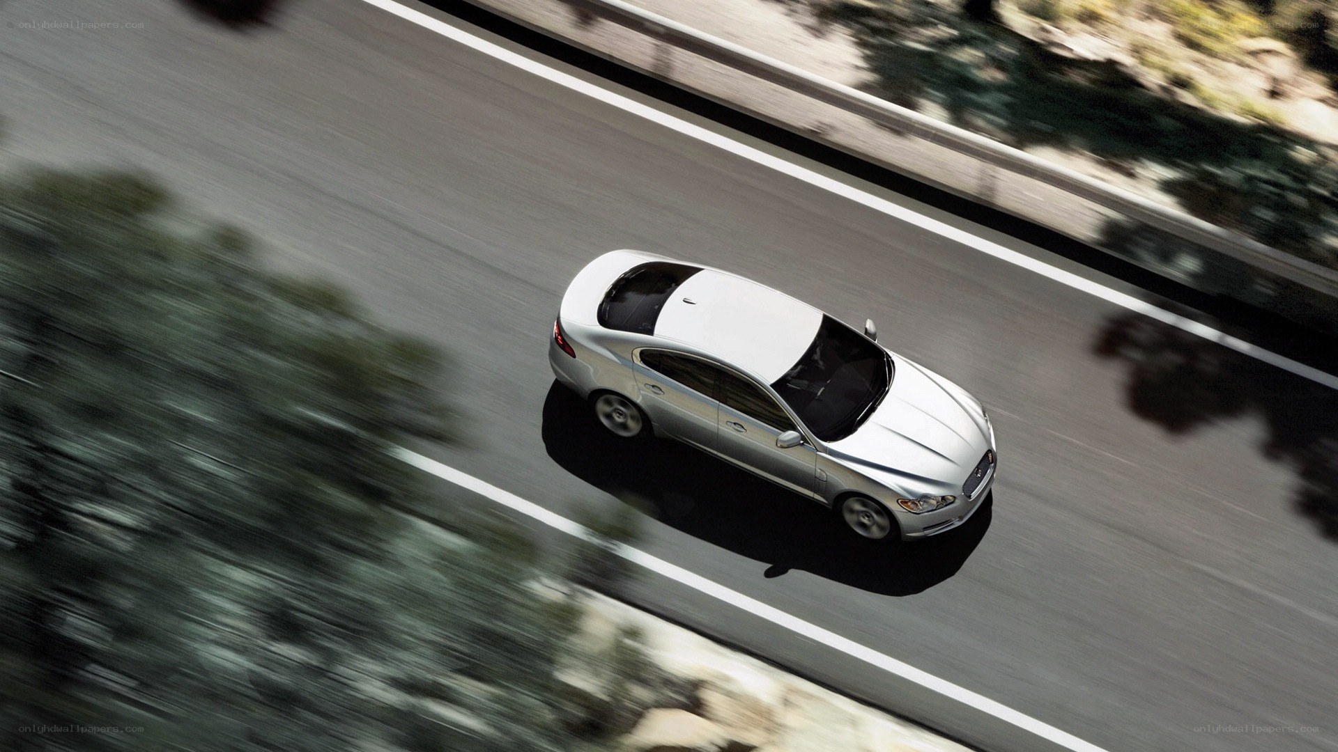 silver car on winding road