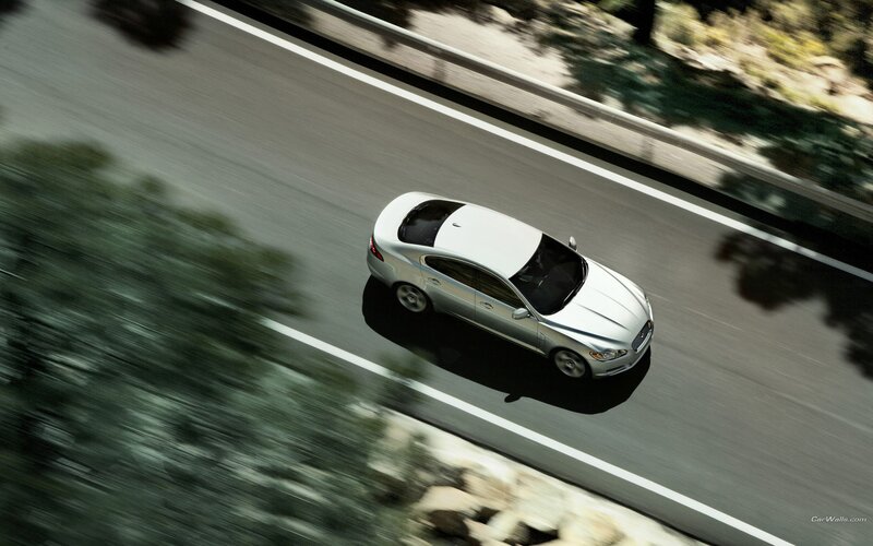 silver car on winding road