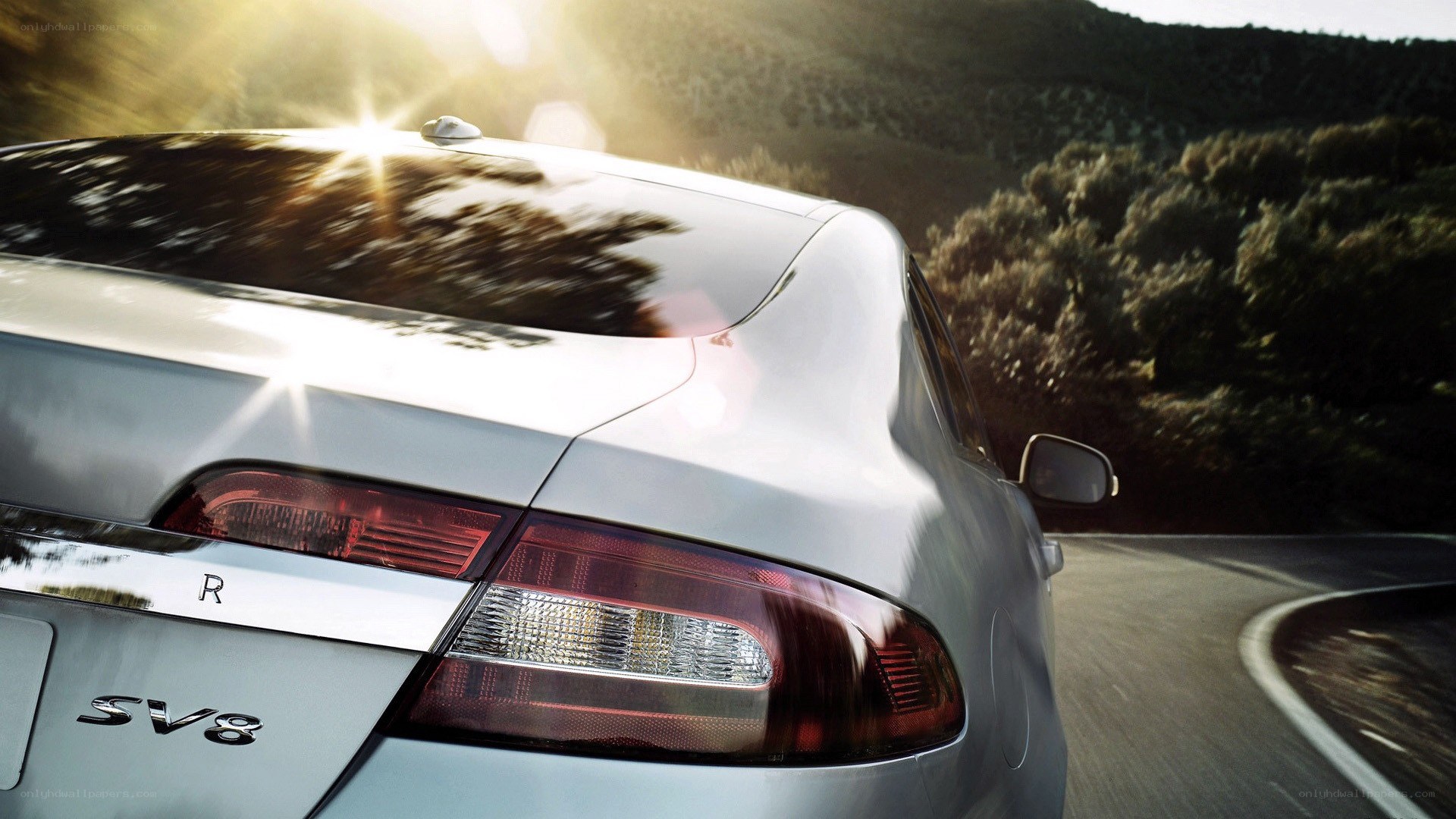 silver car on winding road