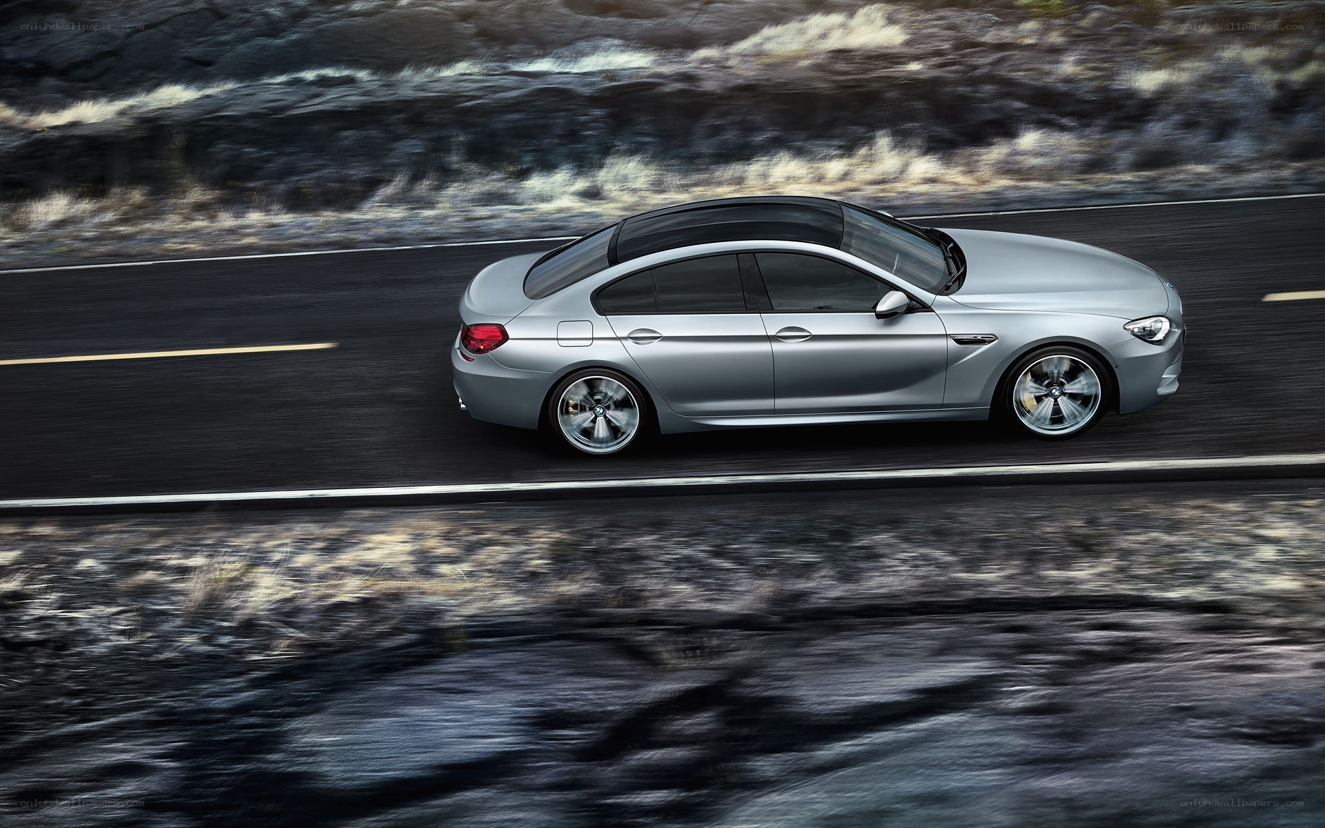 silver car on winding road