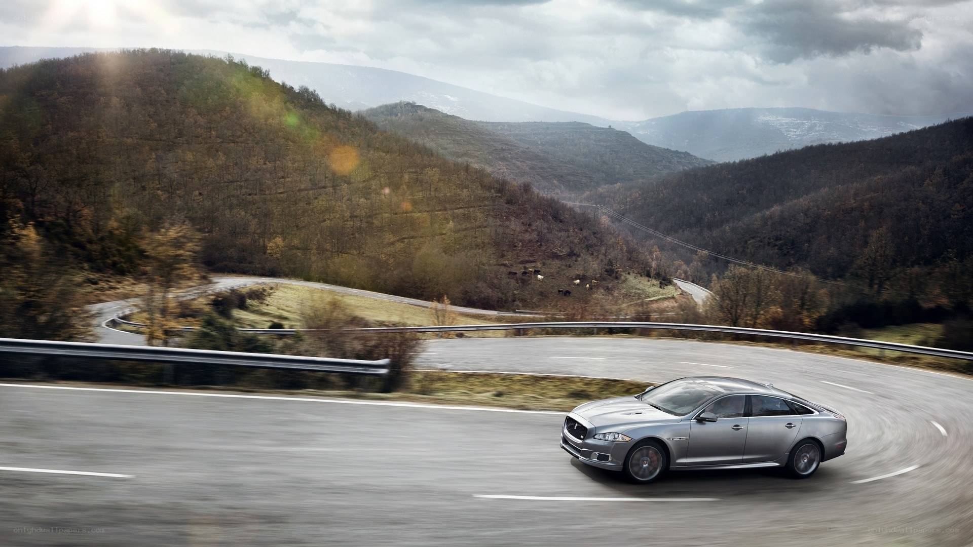 silver car on winding road