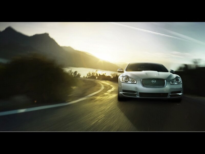 silver car on winding road