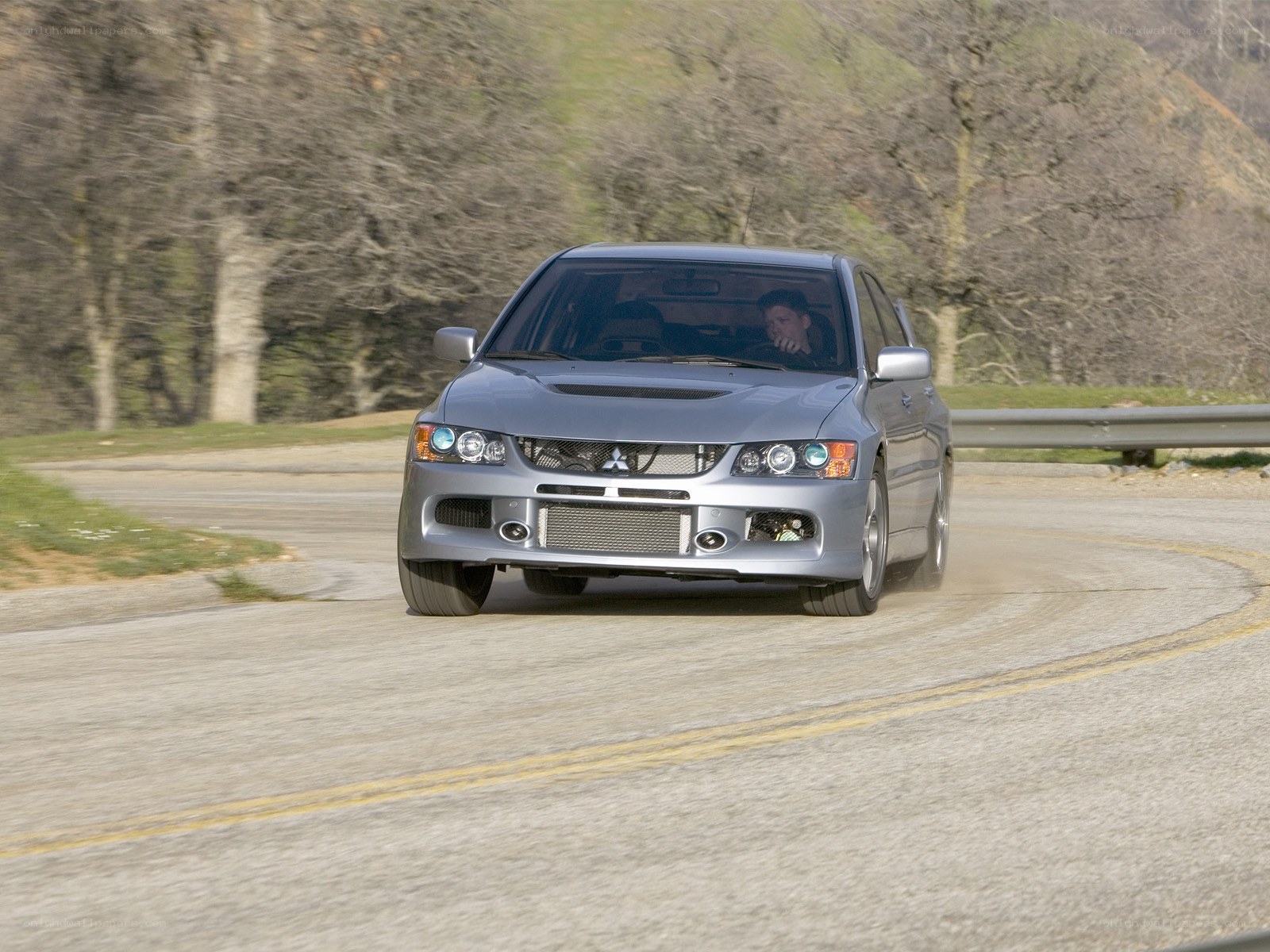 silver car on winding road