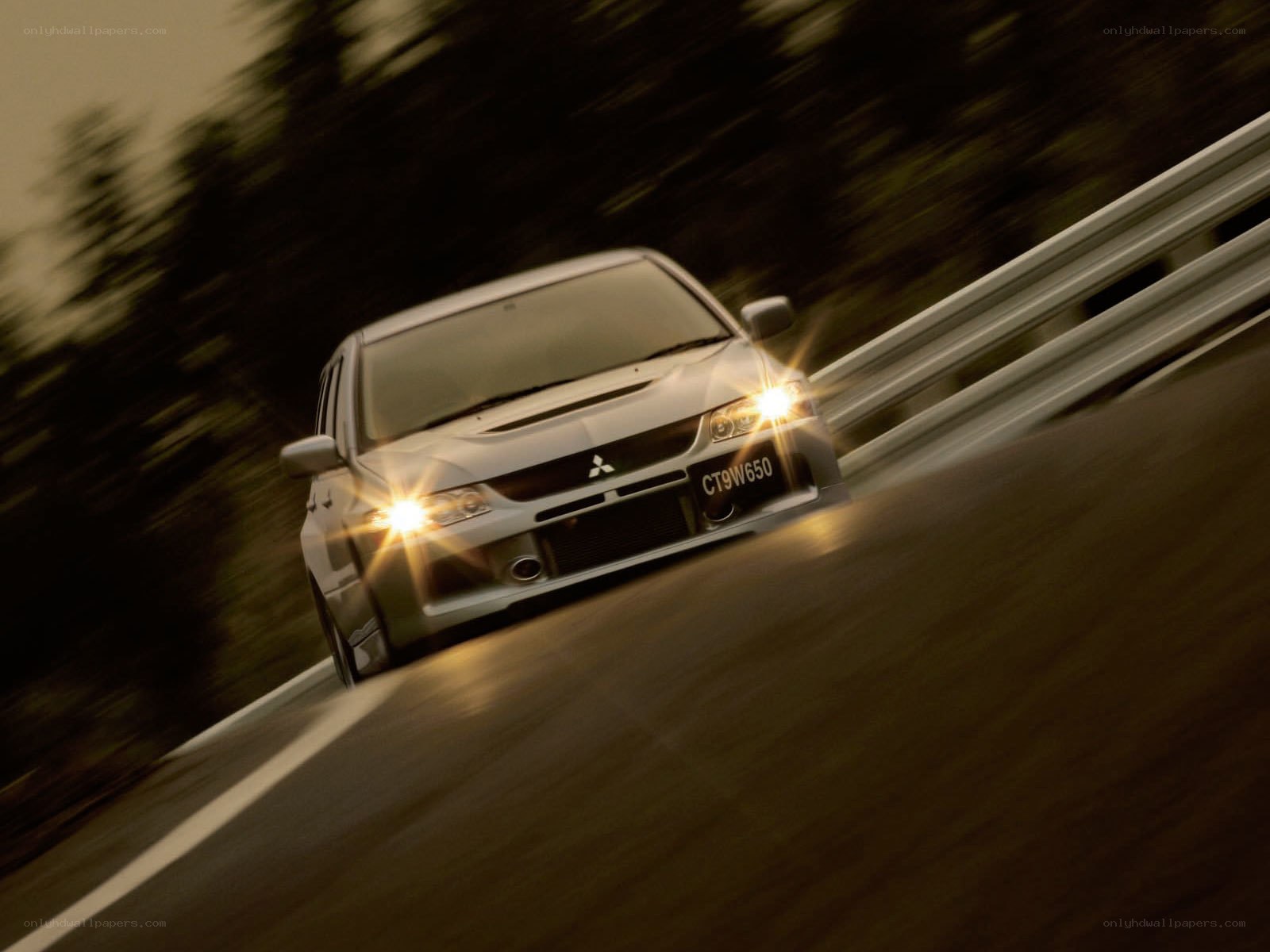 silver car on winding road