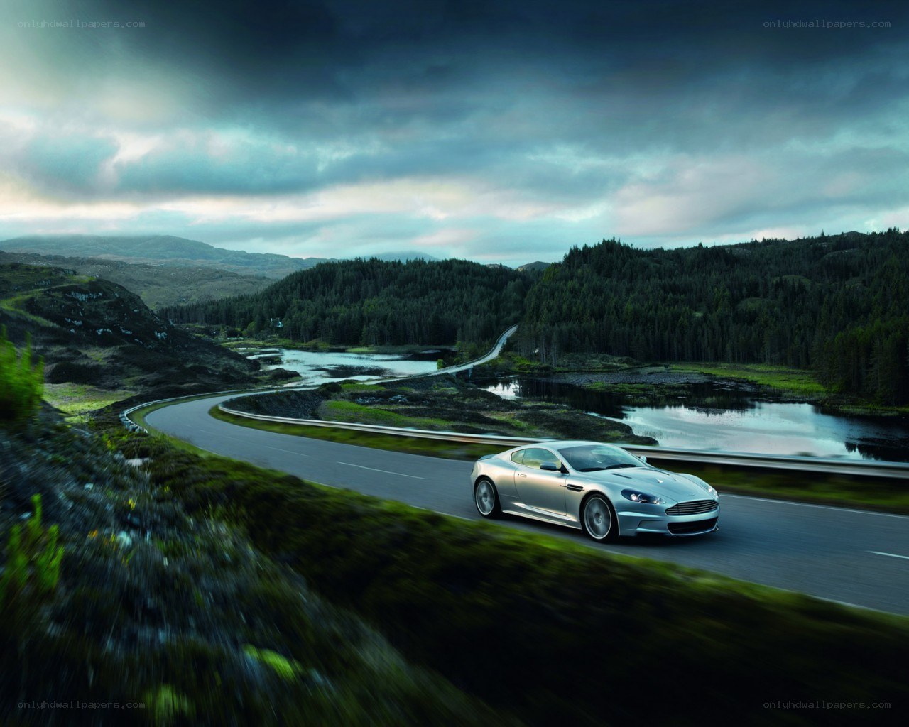 Silver car on winding road