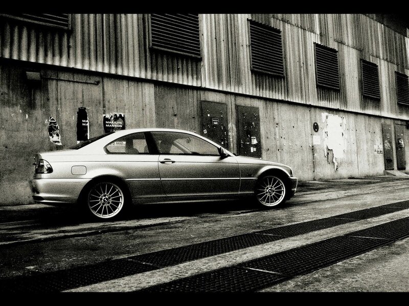 Silver car parked in alley
