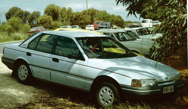 silver car parked in lot