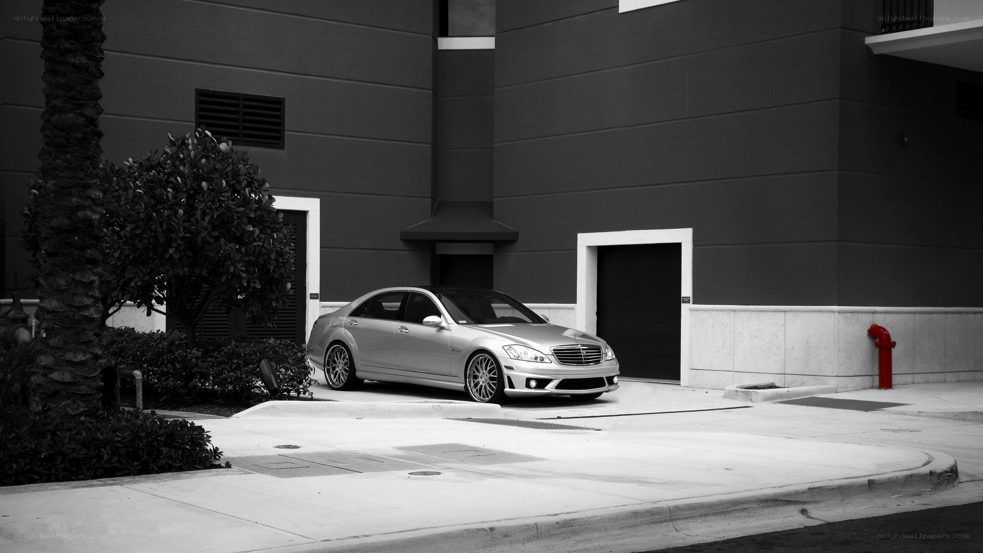 silver car parked outside building