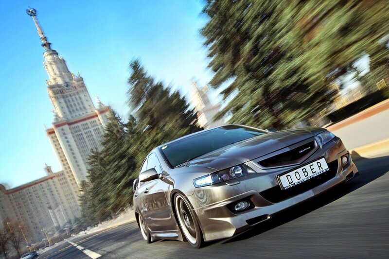 Silver car speeding in city