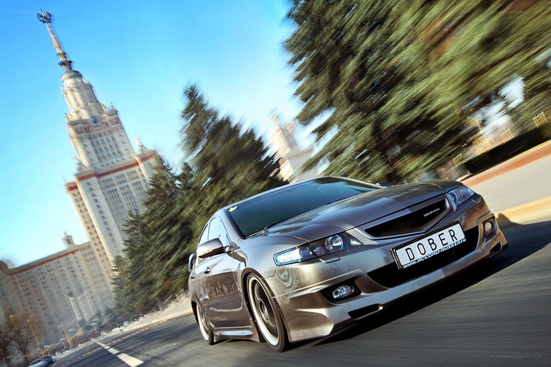 Silver car speeding in city