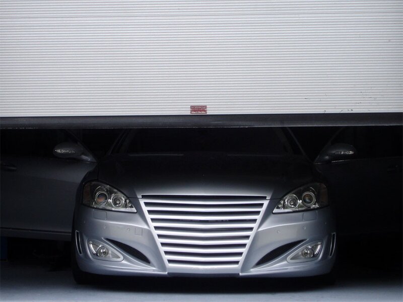 Silver car under garage door