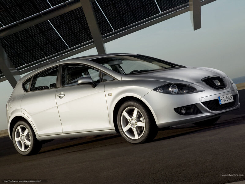 silver car under solar panels