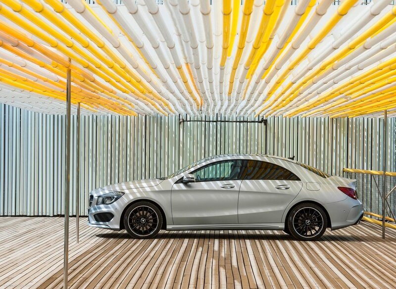 Silver car under yellow canopy