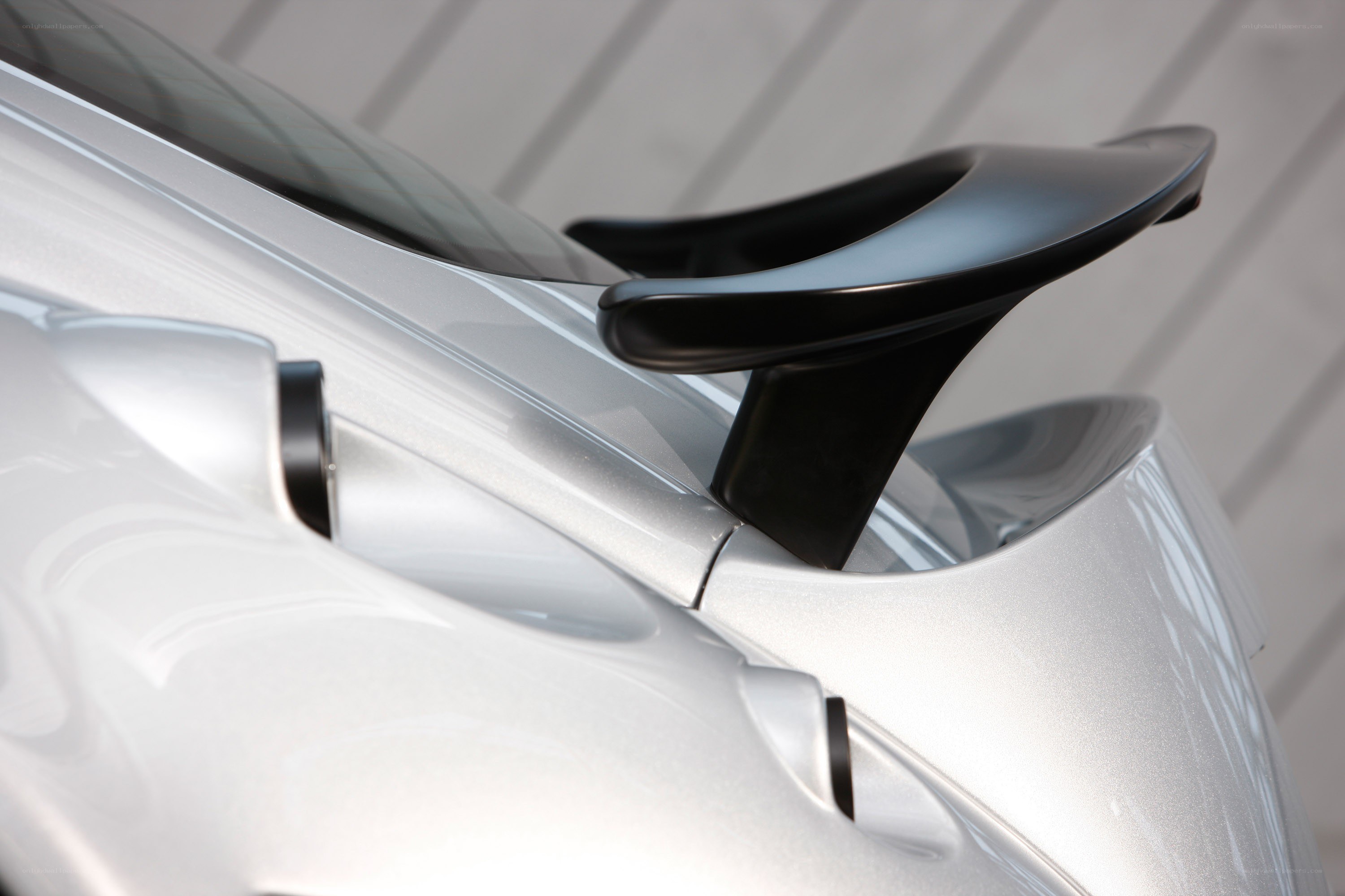 silver car with black spoiler