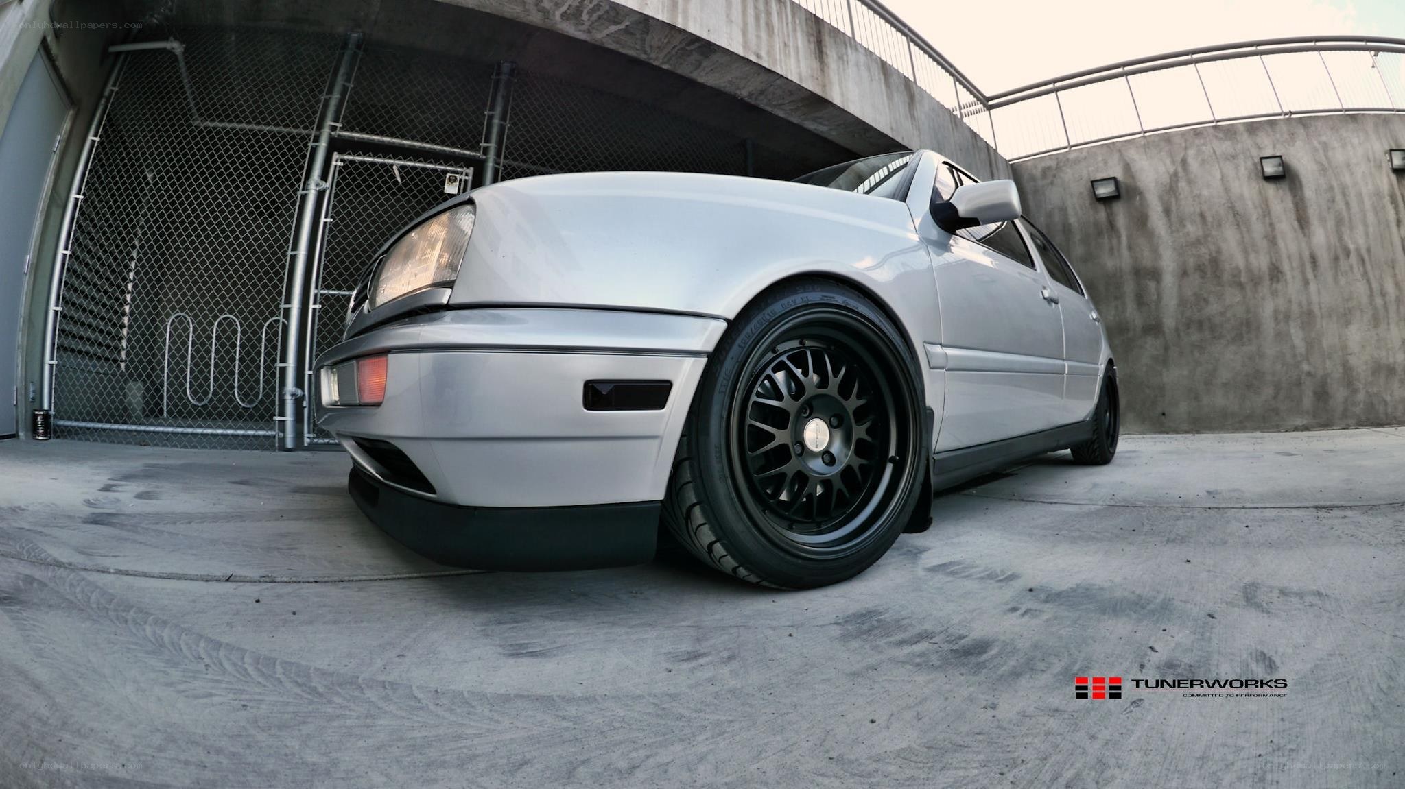 silver car with black wheels
