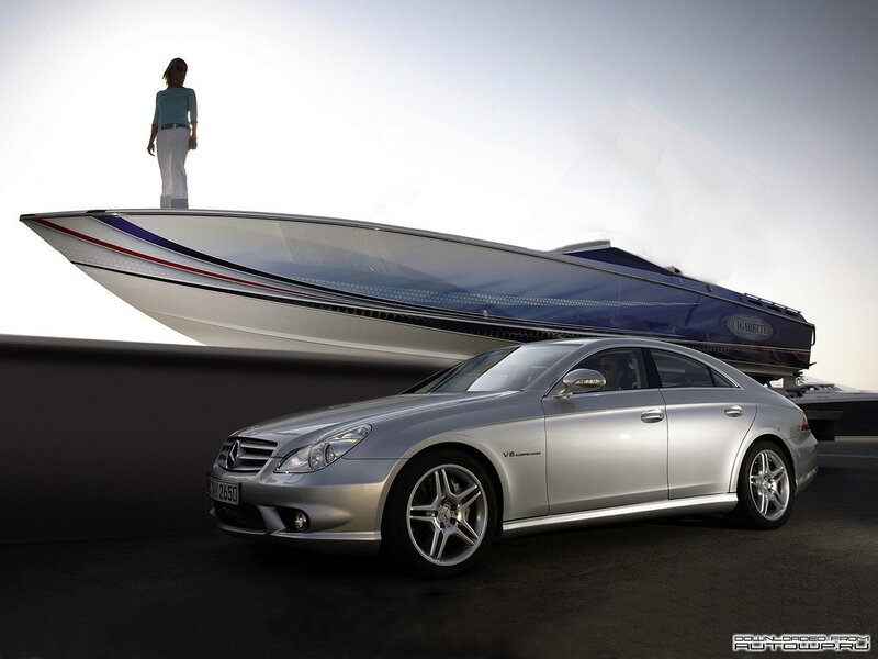 Silver car with boat on roof