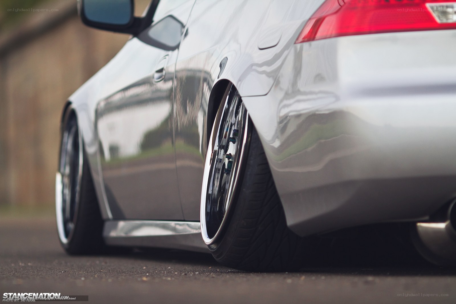 silver car with custom wheels