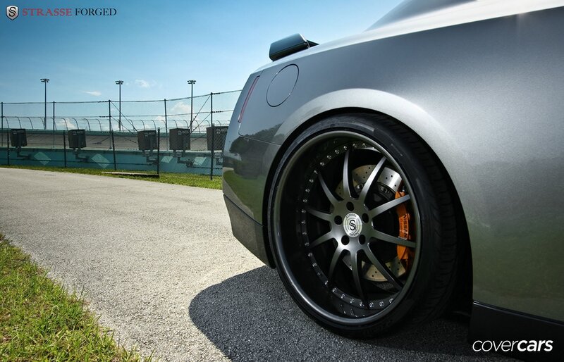 silver car with custom wheels