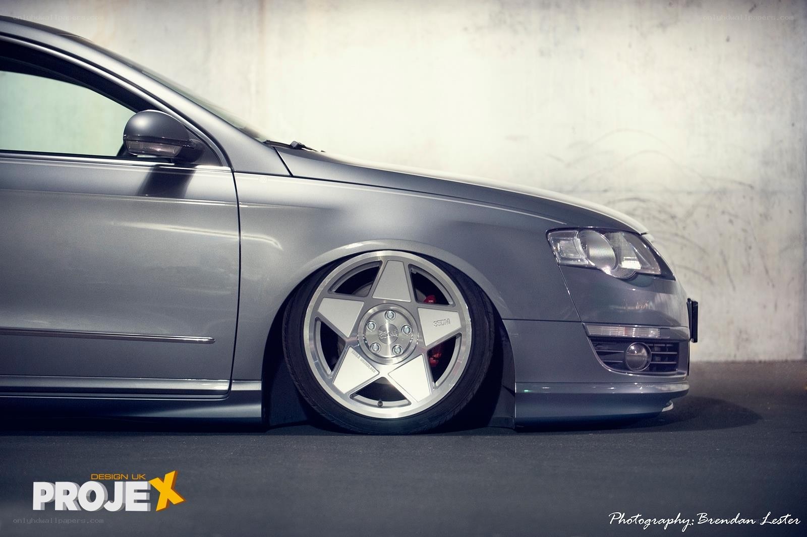 silver car with custom wheels