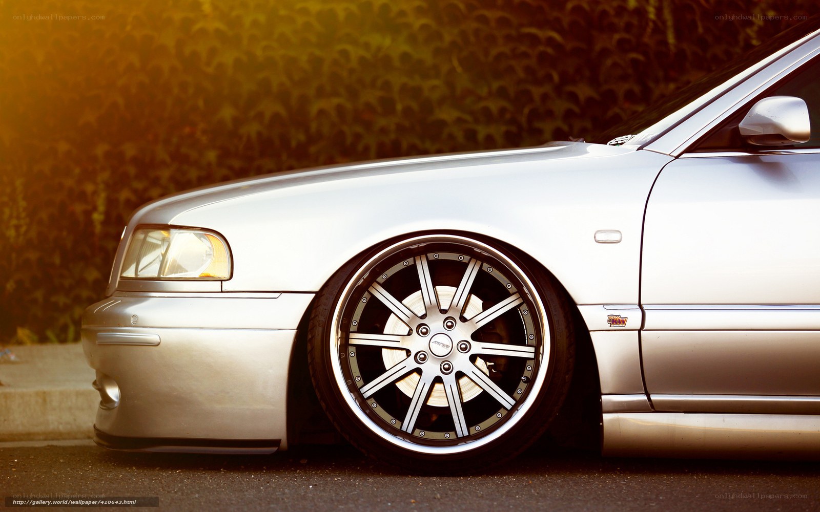 silver car with custom wheels
