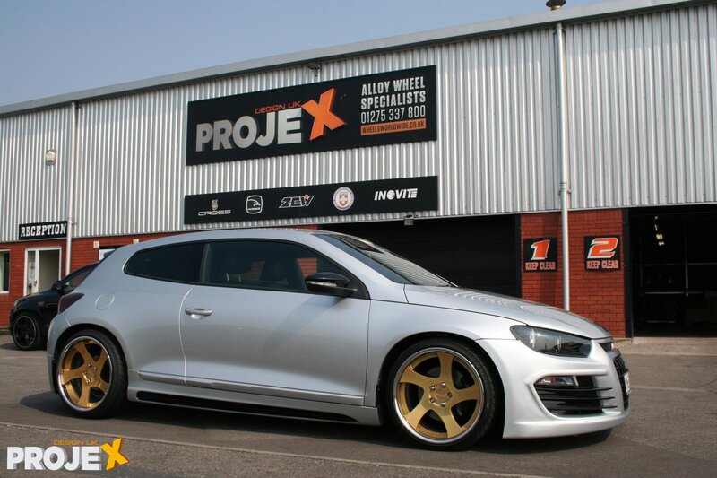 Silver car with gold wheels