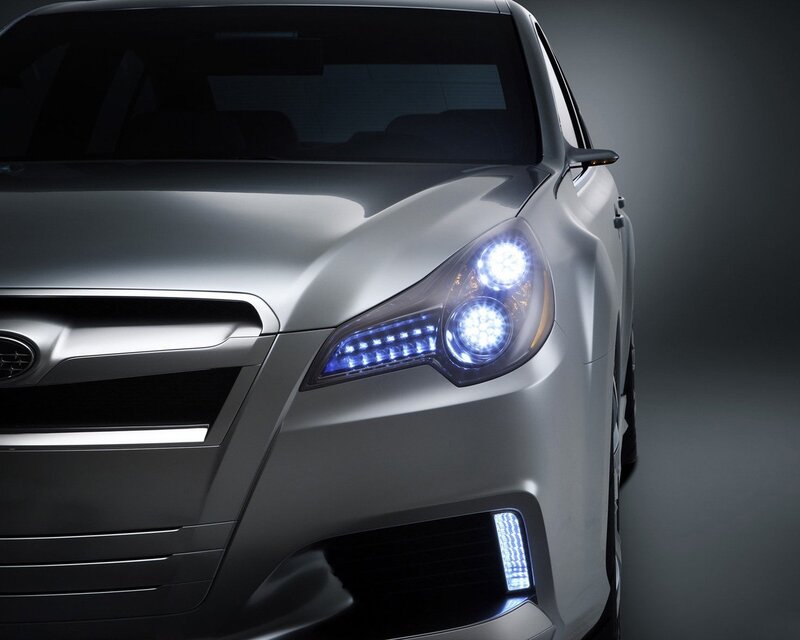silver car with illuminated headlights