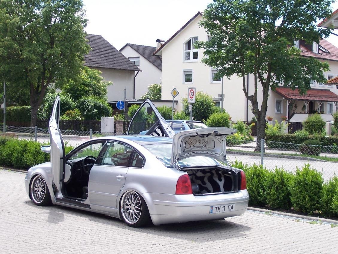 silver car with open doors