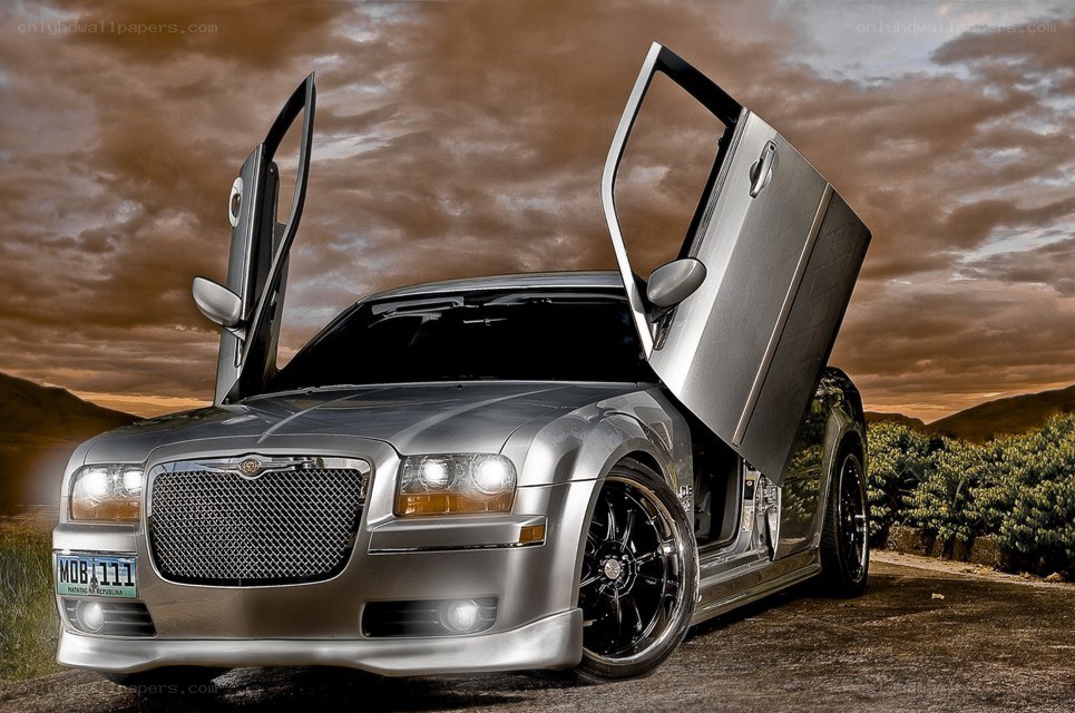 silver car with open doors