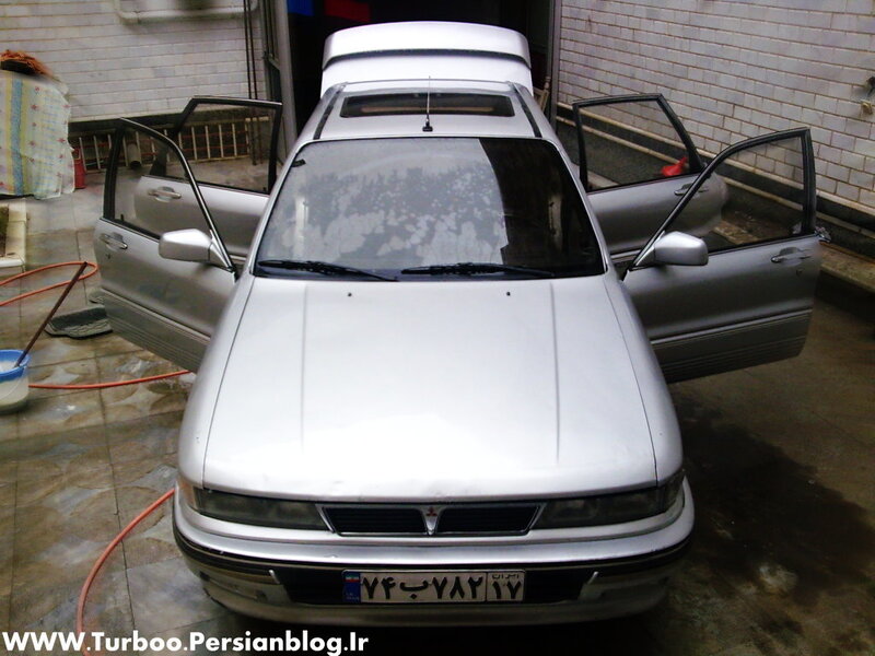 silver car with open doors