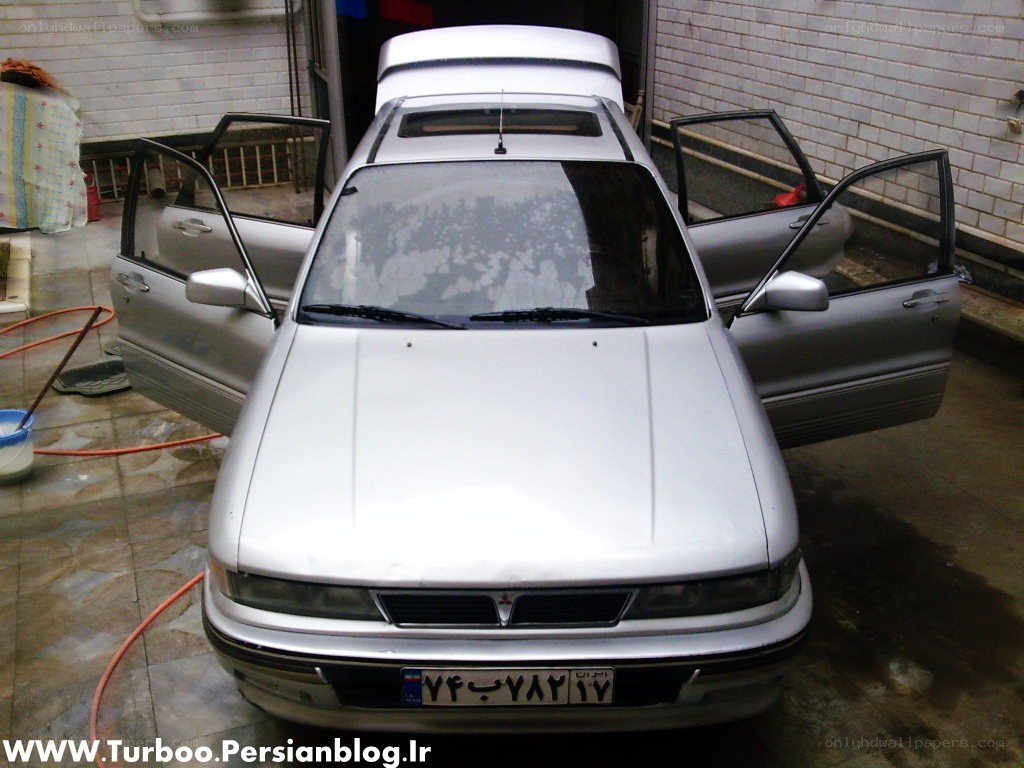 silver car with open doors