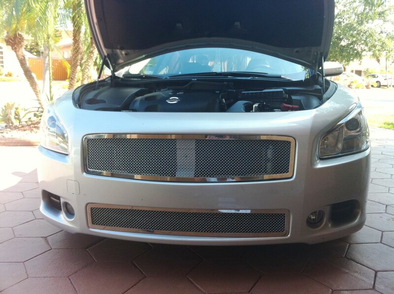 silver car with open hood