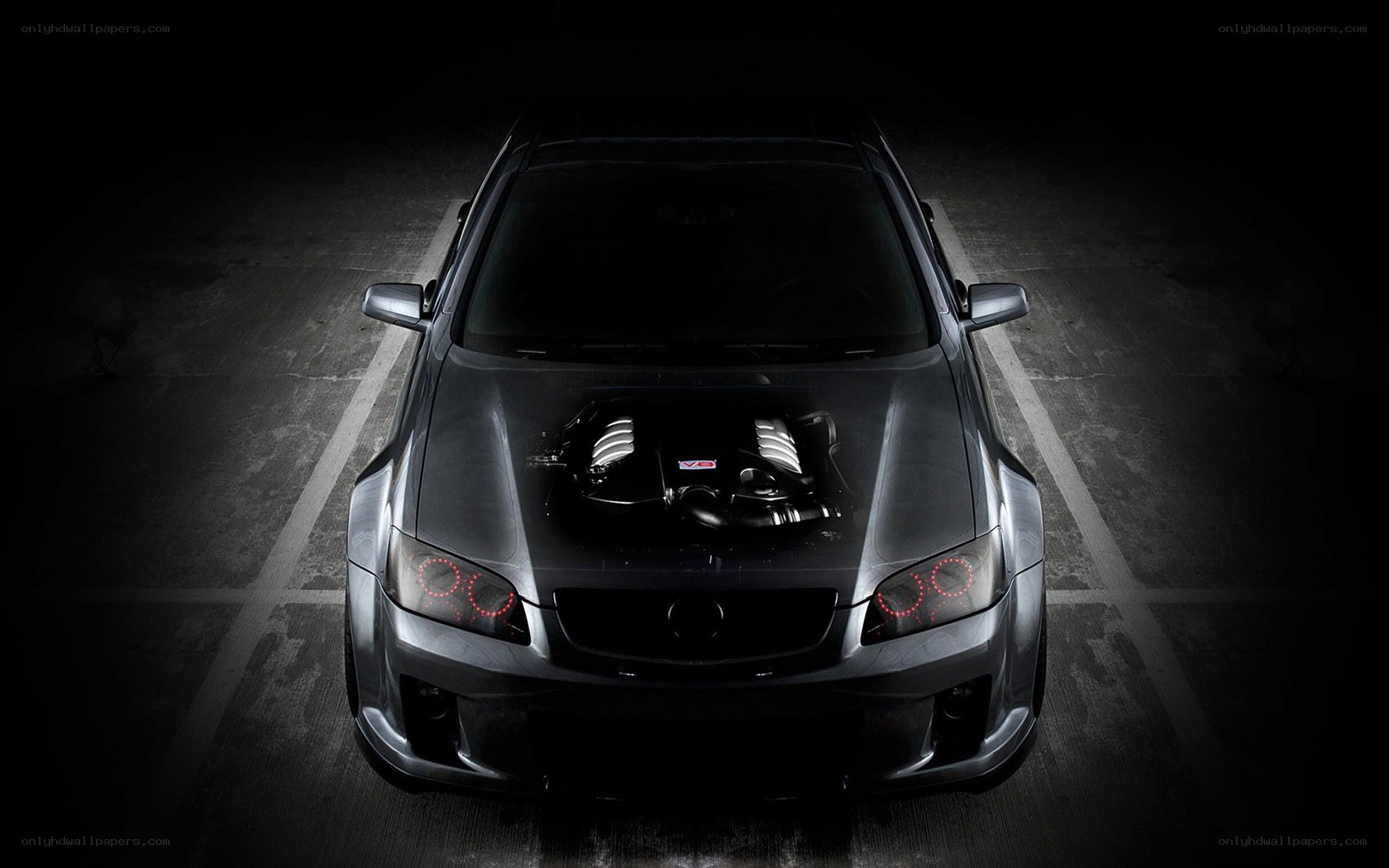silver car with open hood