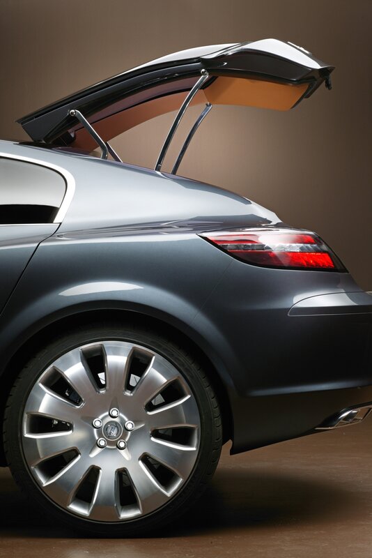 silver car with open trunk