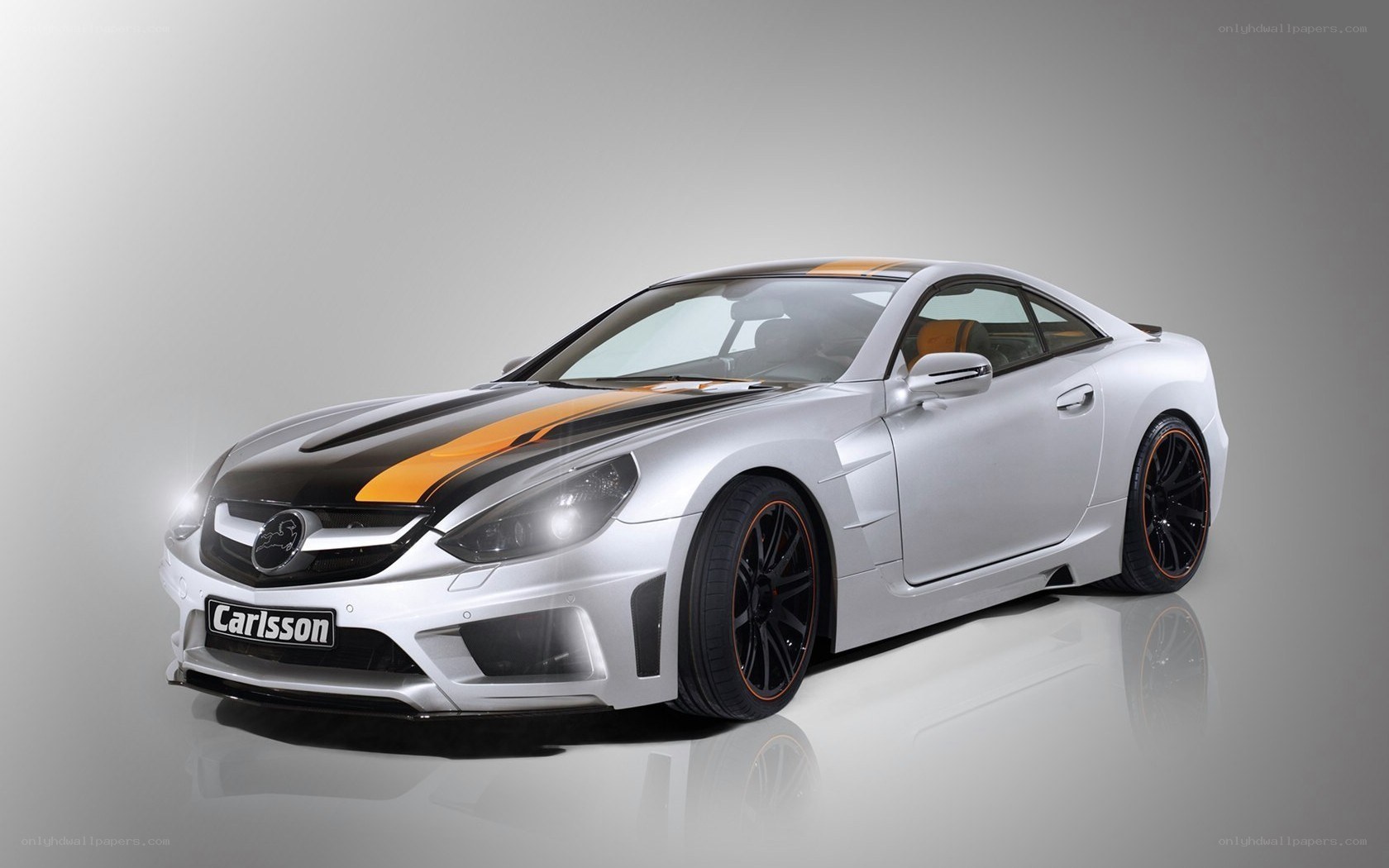 silver car with orange stripes