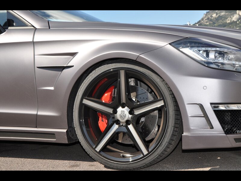 silver car with red brake calipers