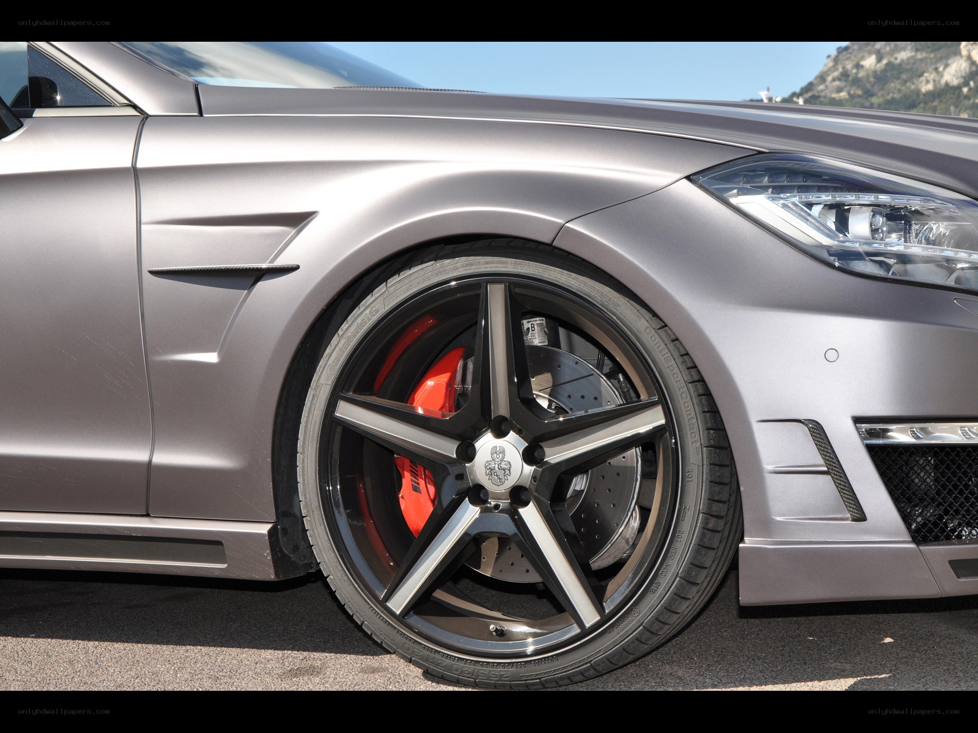 silver car with red brake calipers