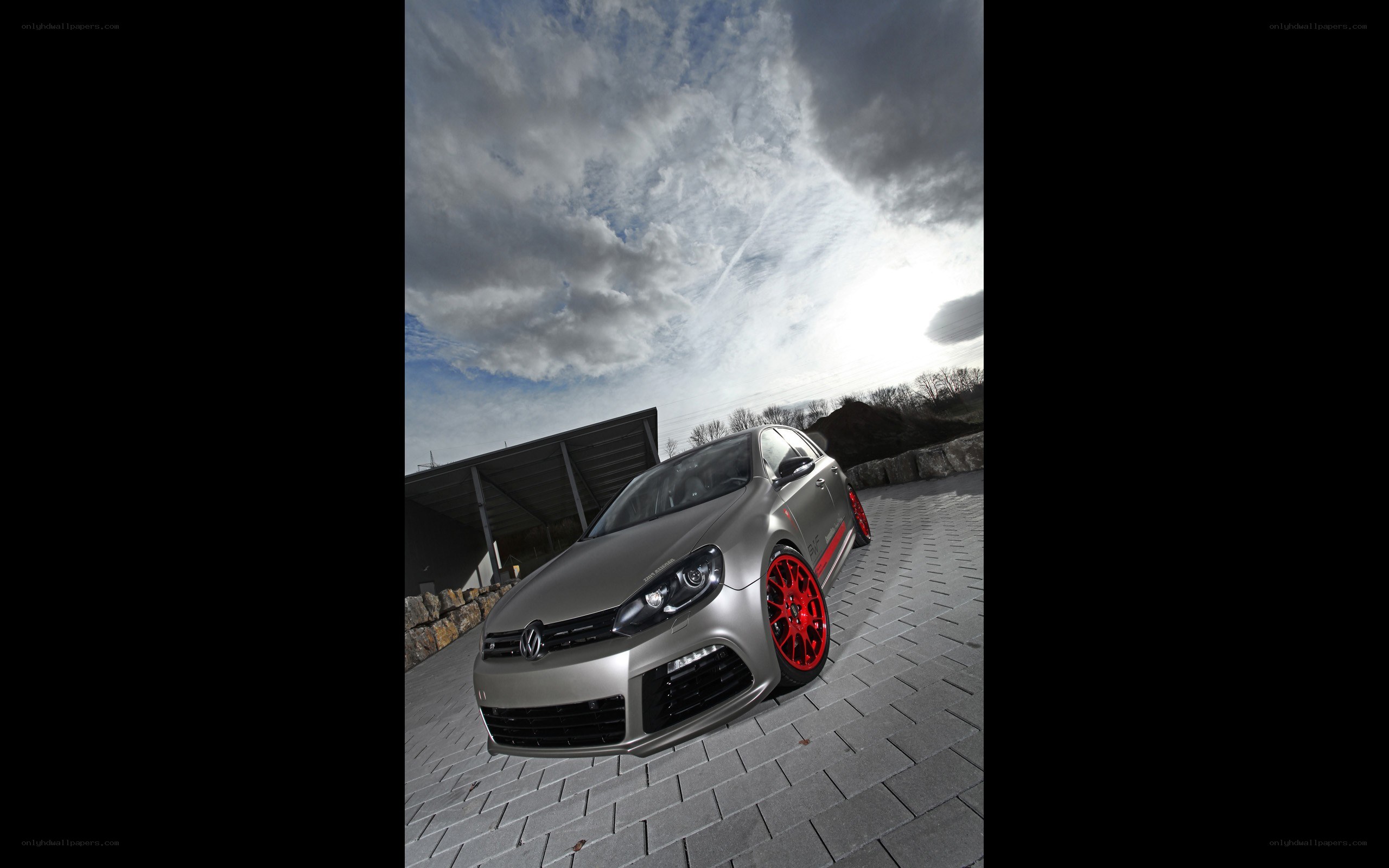 silver car with red wheels