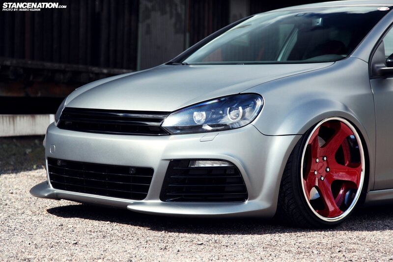 Silver Car with Red Wheels — Dramatic