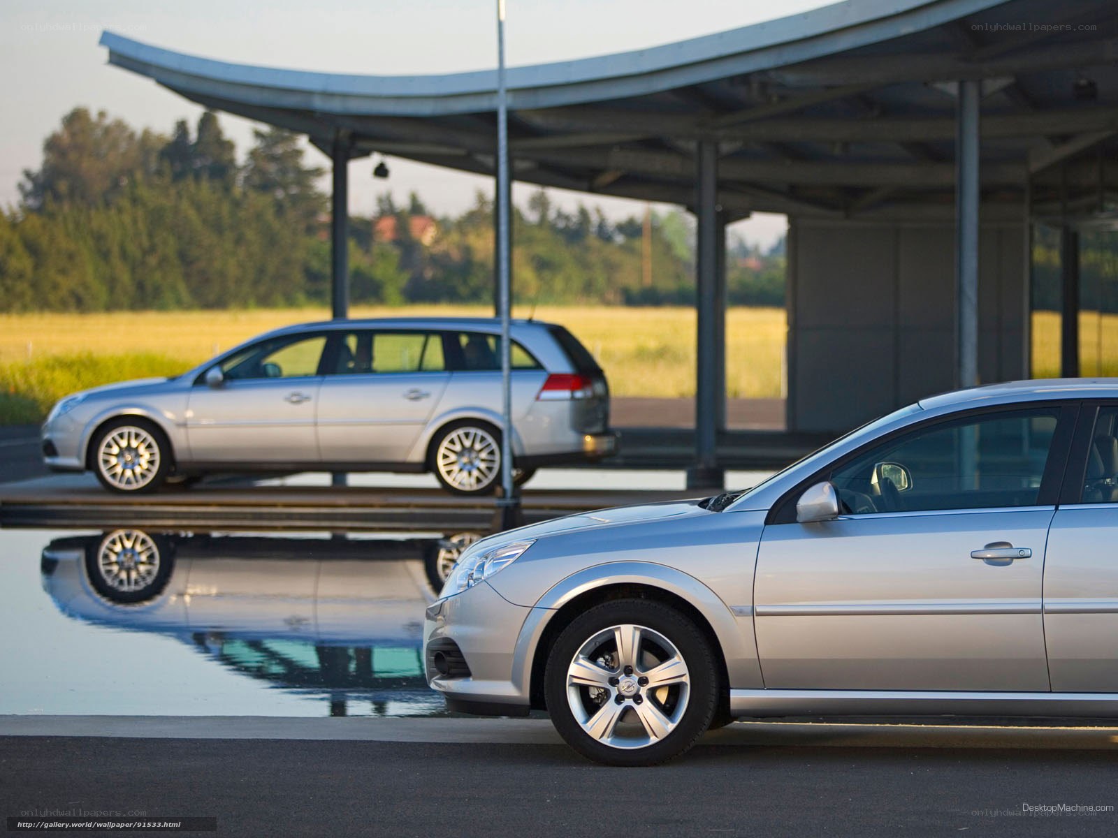 Silver cars at a modern station