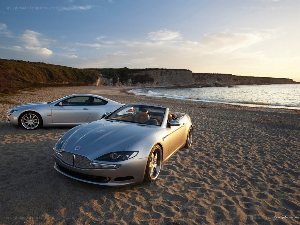 Silver cars on a beach