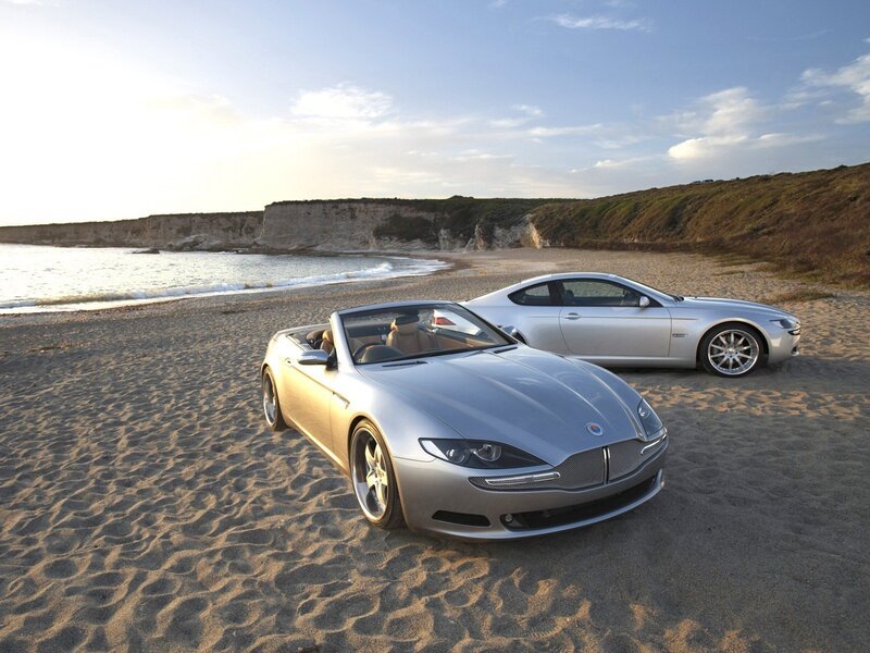 Silver cars on a beach