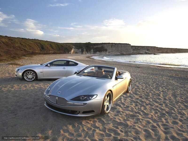 Silver cars on a beach