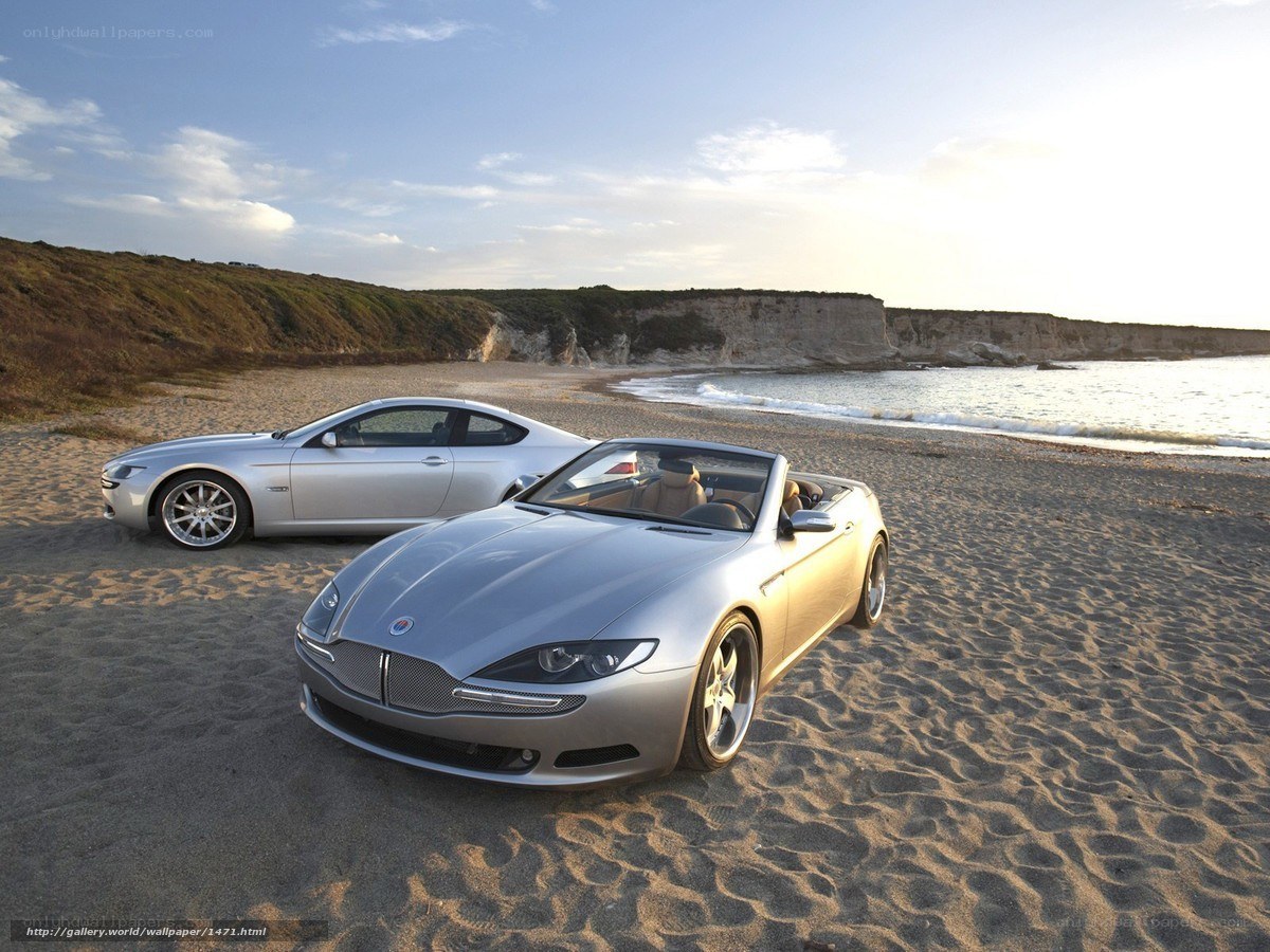 Silver cars on a beach
