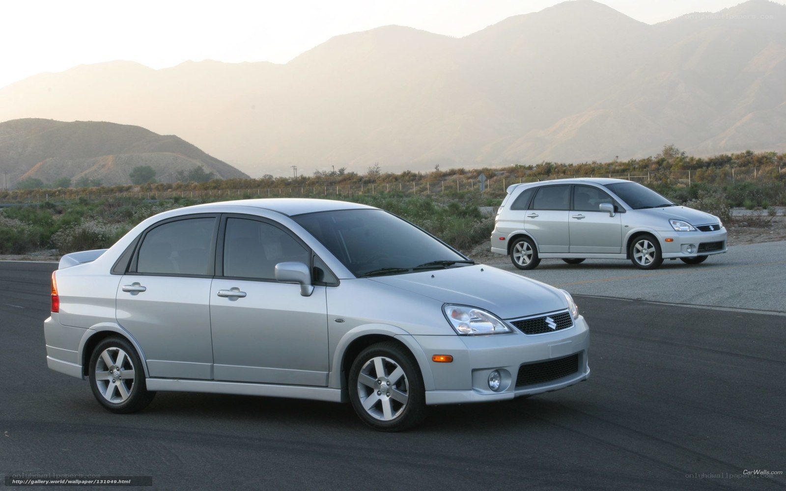 Silver cars on a road