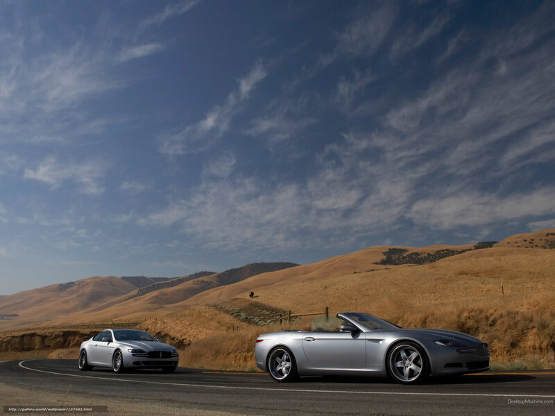Silver cars on a winding road
