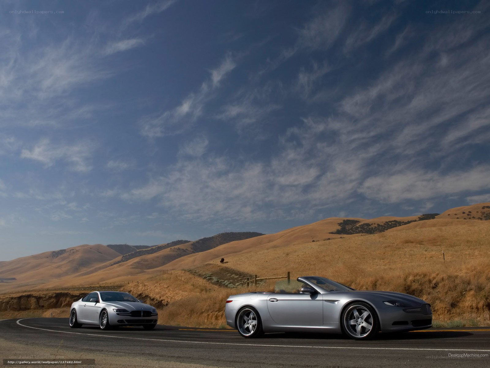 Silver cars on a winding road