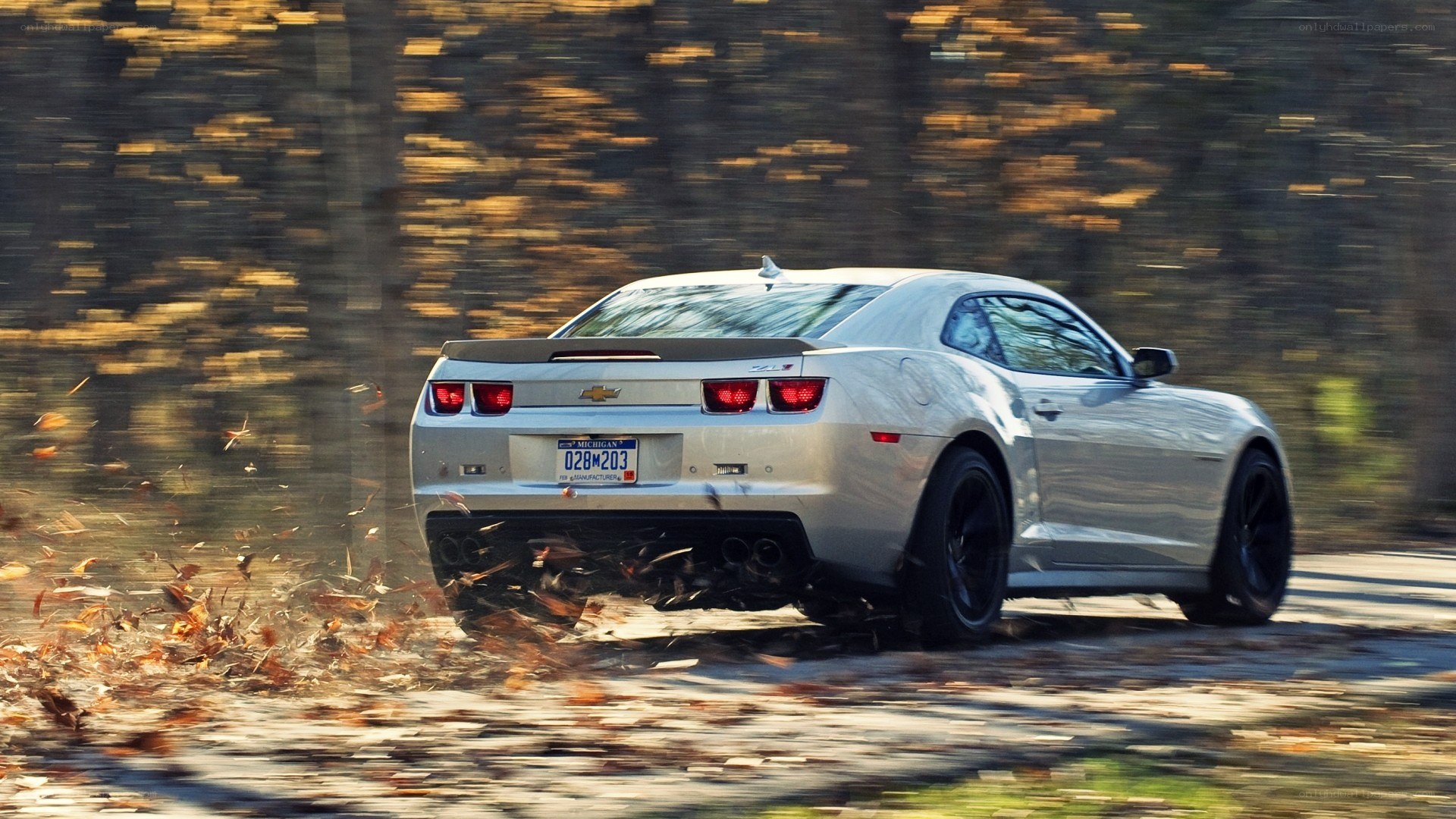 silver chevrolet camaro driving